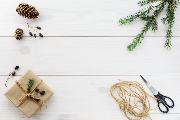 Gift wrapping for Christmas and New Year on a wooden table. Top view, copy space.