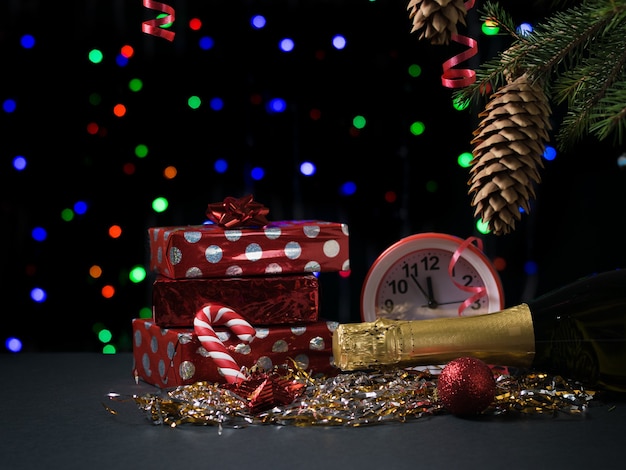 Gifts, champagne, watches and sweets. Concept of Christmas and new year.