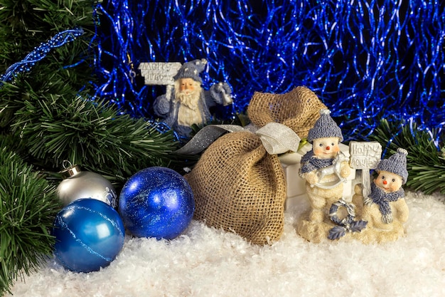 The gifts Christmas balls lie on the table closeup