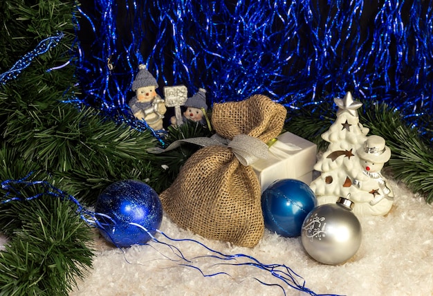 The gifts Christmas balls lie on the table closeup