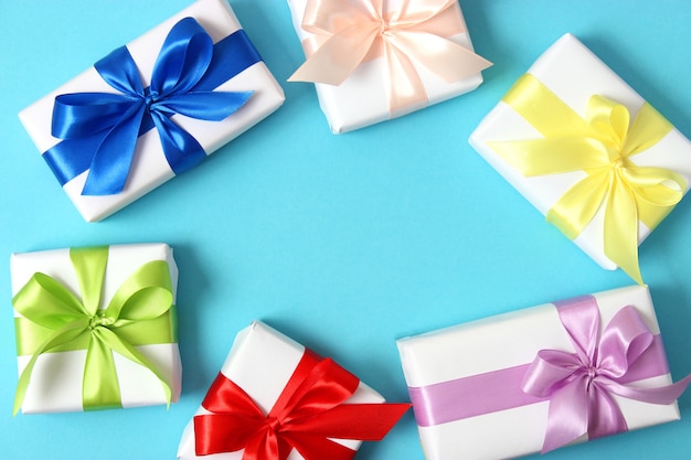 Gifts on a colored background holiday giving presents birthday