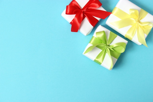 Gifts on a colored background holiday giving presents birthday