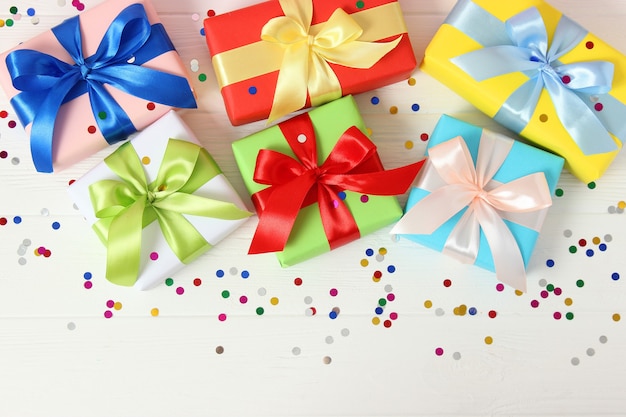 Gifts on a colored background top view holiday giving presents birthday