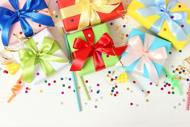 Gifts on a colored background top view holiday giving presents birthday