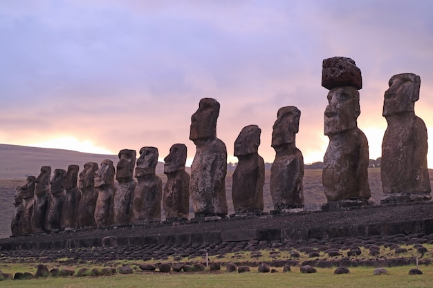 Gigantic 15 Moai statues of Ahu Tongariki against beautiful sunrise cloudy sky, Easter Island, Chile