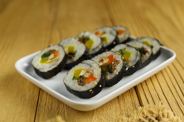 Gimbap or kimbap is a Korean food made from steamed white rice and various other ingredients