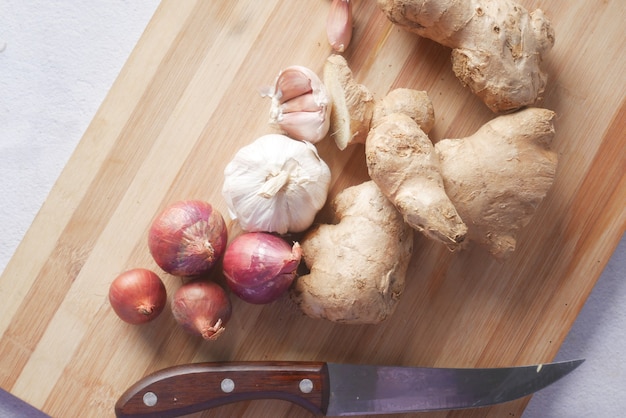 Ginger and garlic on chopping board top view