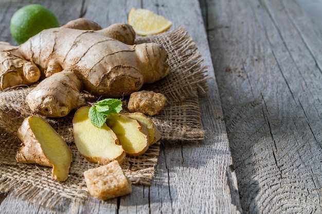 Ginger lemon mint honey on rustic wood background