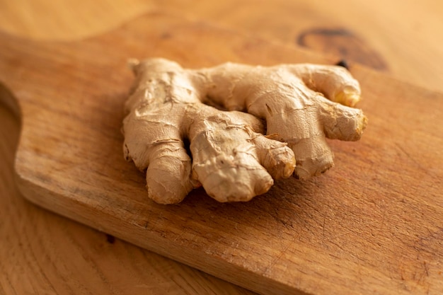 Ginger on wooden table close up