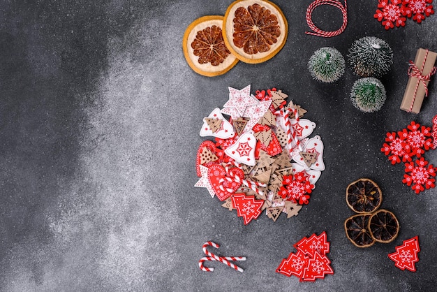 Gingerbread Christmas tree decorations dried citrus fruits on a gray concrete background