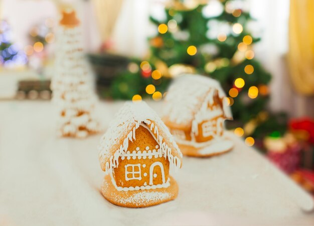 Gingerbread cookie house in the Christmas village on the fair. Holiday traditional aroma dessert with honey and spices