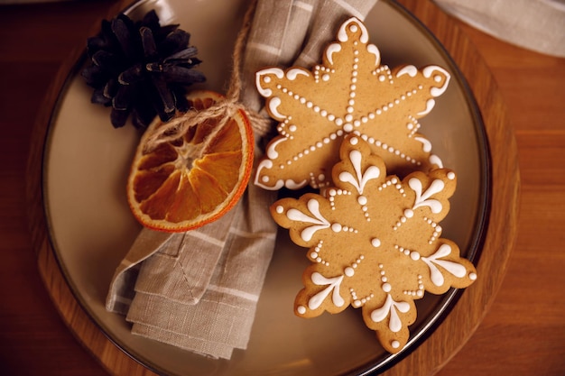 Gingerbread cookie on a plate on wooden table