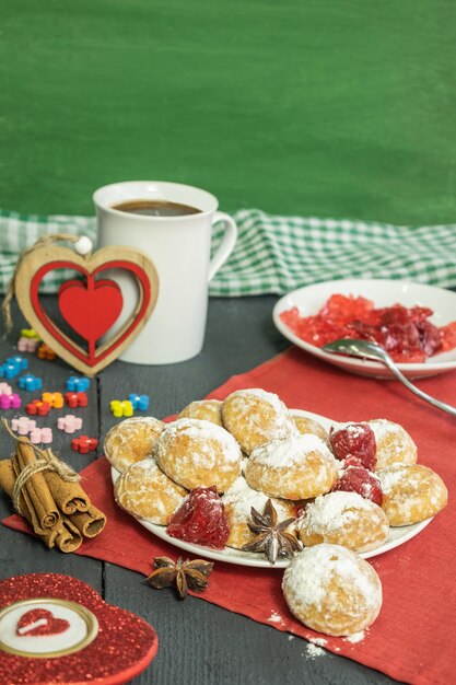 gingerbread cookies on a red napkin festive breakfast valentines day pastries a cup of coffee