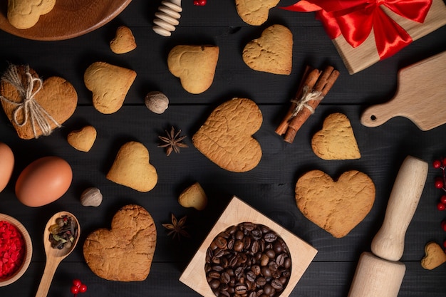 Gingerbread heart shaped cookies, spices, coffee beans and baking supplies, 