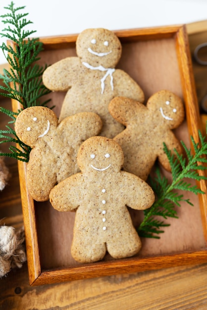 Gingerbread Man Cooking gingerbread cookies at home lies on a wooden tray The concept of the holiday of Christmas and New Year