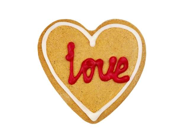 Gingerbread in the shape of heart with red inscription love