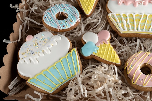 Gingerbreads in the form of a donuts ice cream and cakes Laid out in a gift box