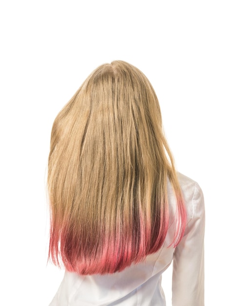 A girl adjusts her dyed hair isolated on a white background