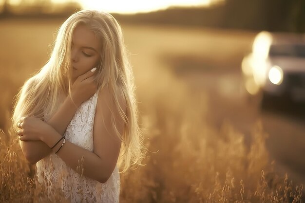 girl adult in an oat field sexy / happy girl in a summer field, blonde with long hair