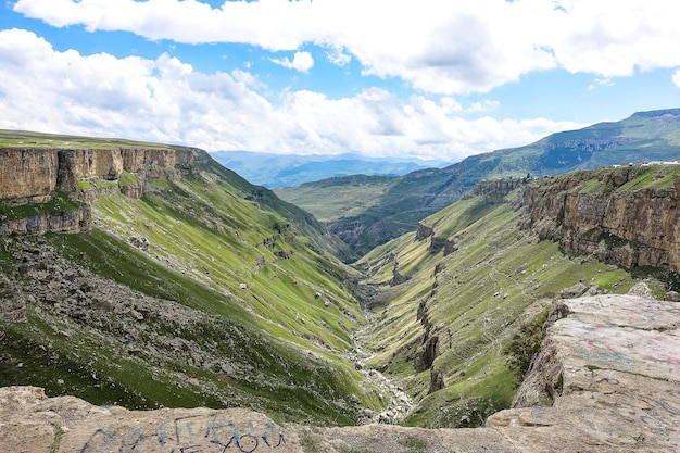 A girl against the background of the Khunzakh valley Khunzakh waterfalls a canyon in Dagestan 2021