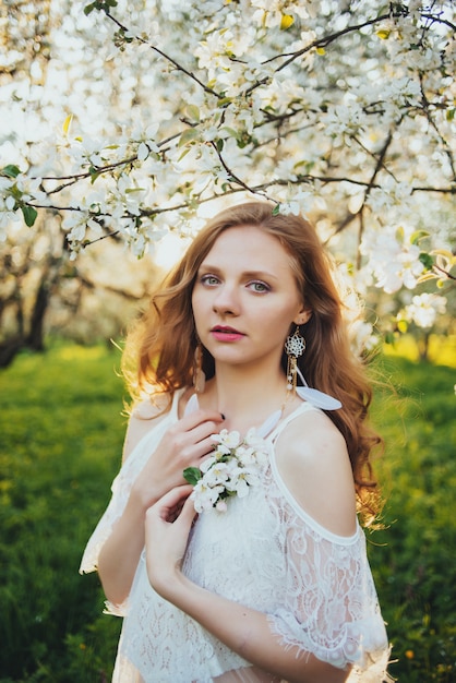 A girl in an apple orchard