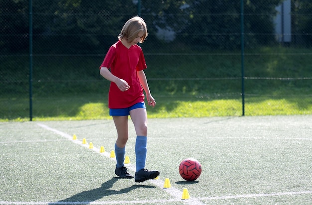 Photo girl arranges flip cups at football practice