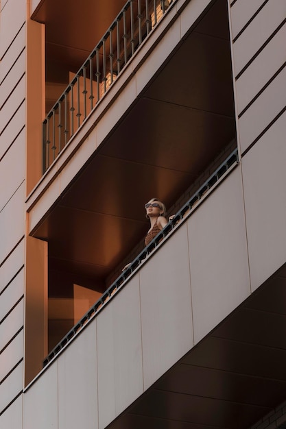 Girl on the balcony of a multistorey building