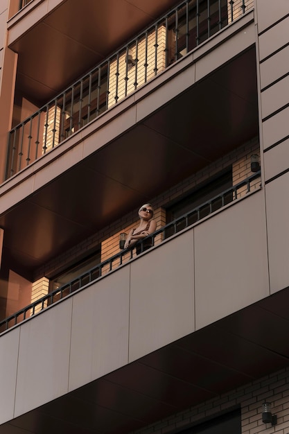 Girl on the balcony of a multistorey building