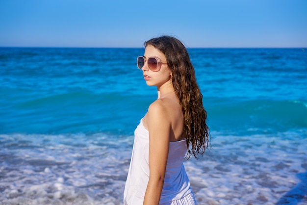 Girl in beach sea shore with summer dress