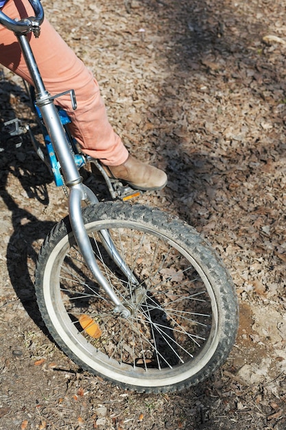 Girl on bicycle on country road