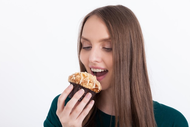 Girl biting cupcake