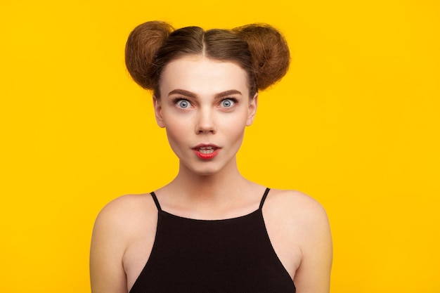 Girl in black top staring at camera