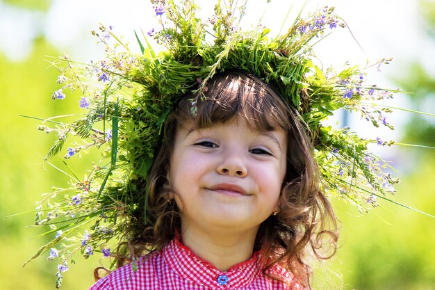 Girl blowing dandelions in the air. selective focus.