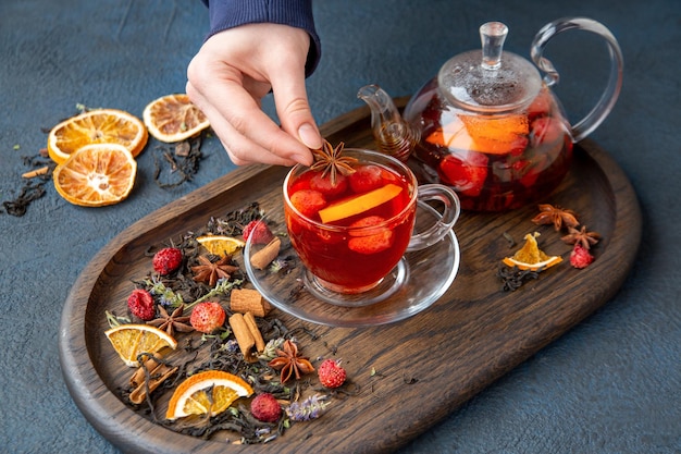 Girl brew fruit tea in a glass bowl Healthy food vitamins antioxidants