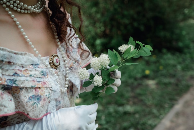 Girl bride holding a flower