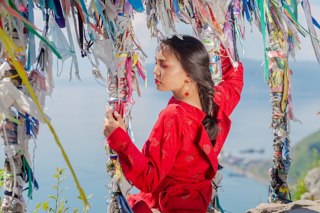 The girl of Buryat appearance on Lake Baikal