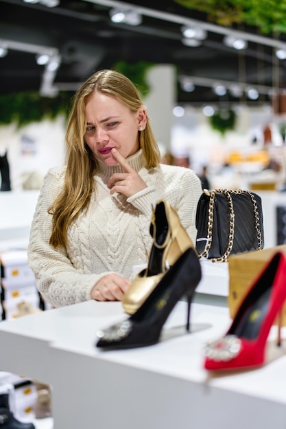 girl buys shoes in the store