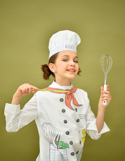 A girl in chef's clothes. Cooking. Banner.