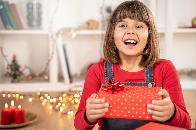 Girl child surprised happy face in christmas time