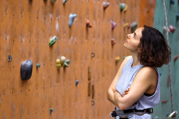 Girl climbing up the wall