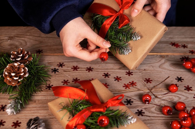 The girl decorates Christmas gifts Celebrating Christmas and New Years