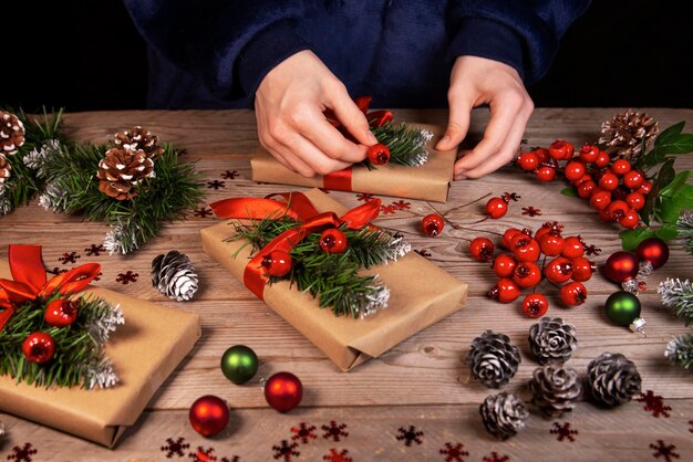 The girl decorates Christmas gifts Celebrating Christmas and New Years