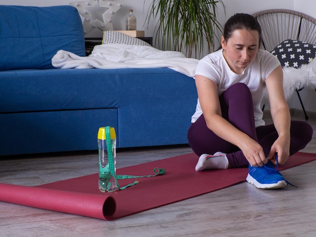 Girl doing exercises at home