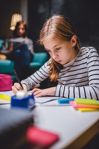 Girl doing homework late at night