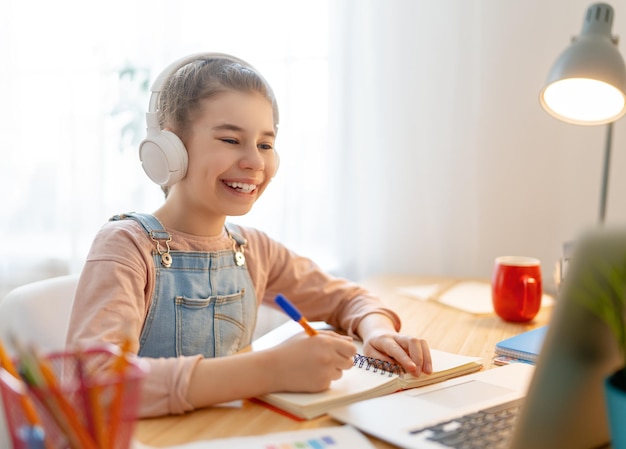 Girl doing homework or online education