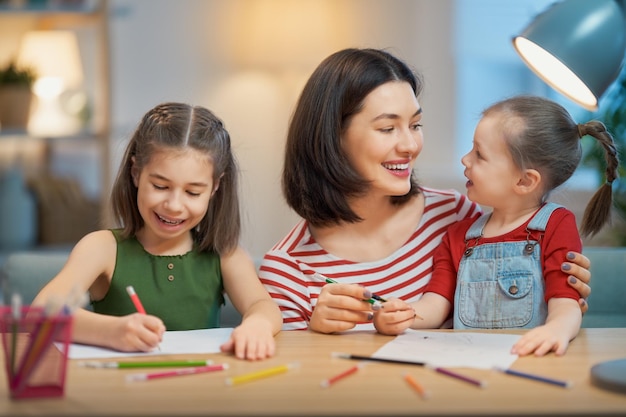 Girl doing homework with mother