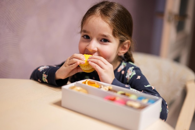 Girl eat delicious tasty sweet color macaron