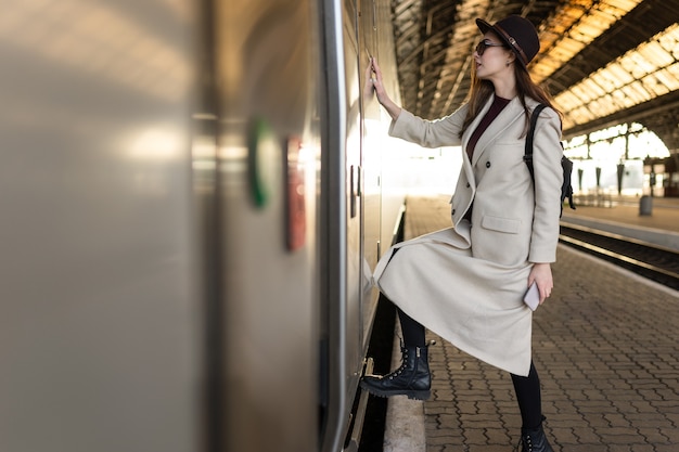 Girl enters to the train car