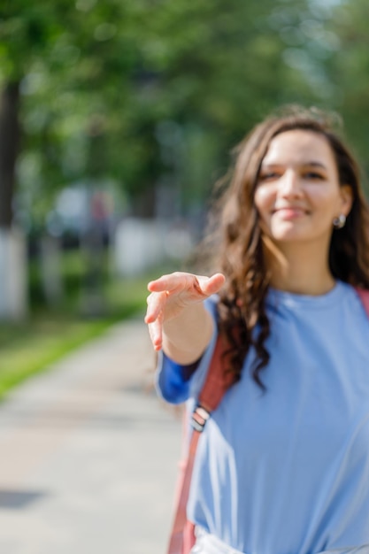 Girl extends a hand to meet