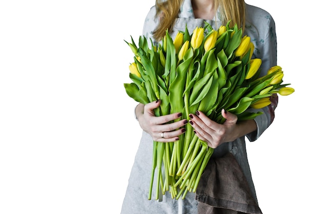 Girl florist holding a bunch of yellow tulips Floristic Isolated on white background